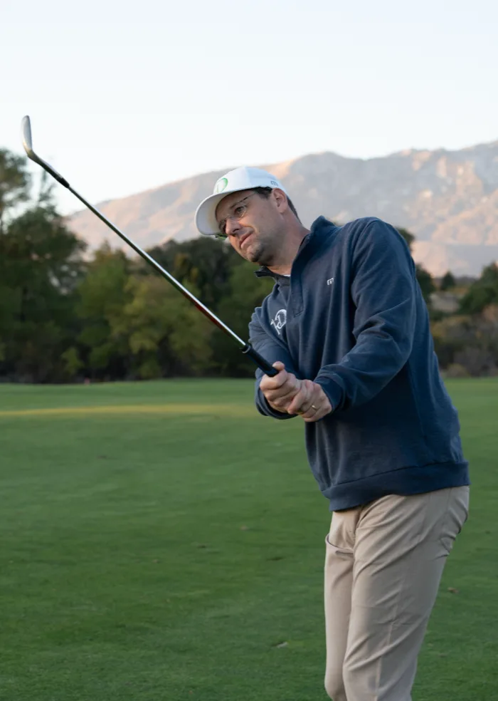 Dan Handy, founder of Handy Golf, swinging a golf club